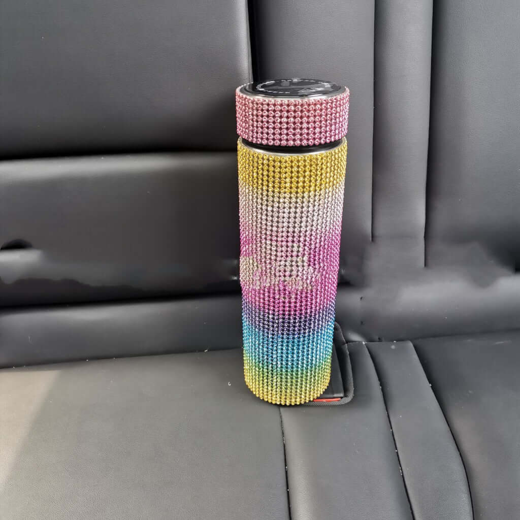 High-Grade Portable Drill Cup adorned with sparkling diamonds, colorful gradient design, resting on a car seat.
