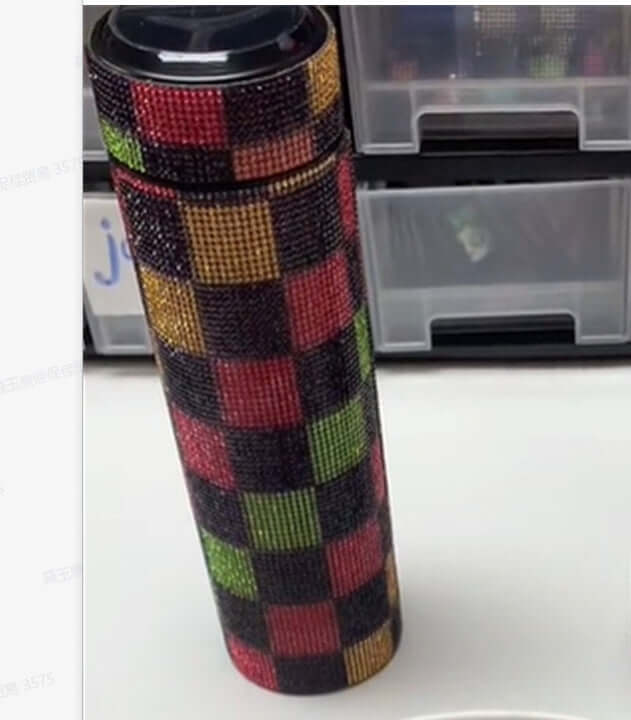 High-grade portable drill cup with a colorful checkered design, blending elegance and function for on-the-go hydration.