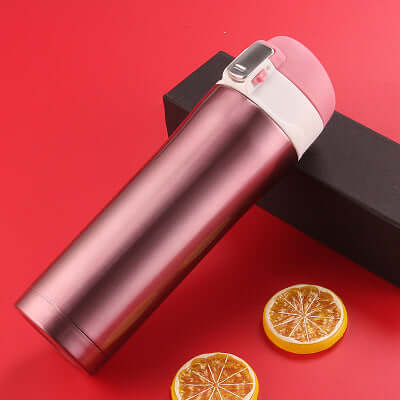 Premium insulated travel mug in pink and silver, perfect for coffee and tea on-the-go.