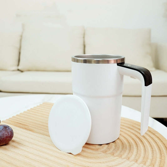 Stylish USB rechargeable electric coffee mug with automatic stirring in a modern setting.