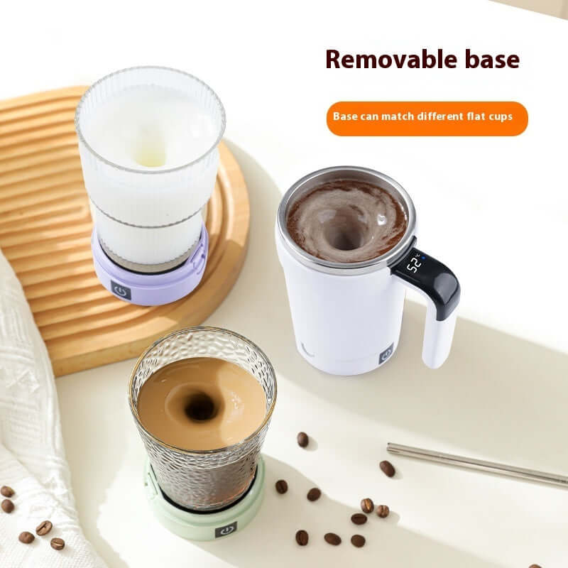 Self-stirring stainless steel travel mug with a removable base on a wooden tray, showcasing its blending feature.